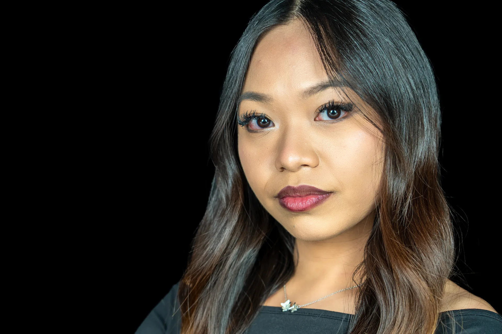 Actor headshot of a woman against a dark background, photographed in Los Angeles